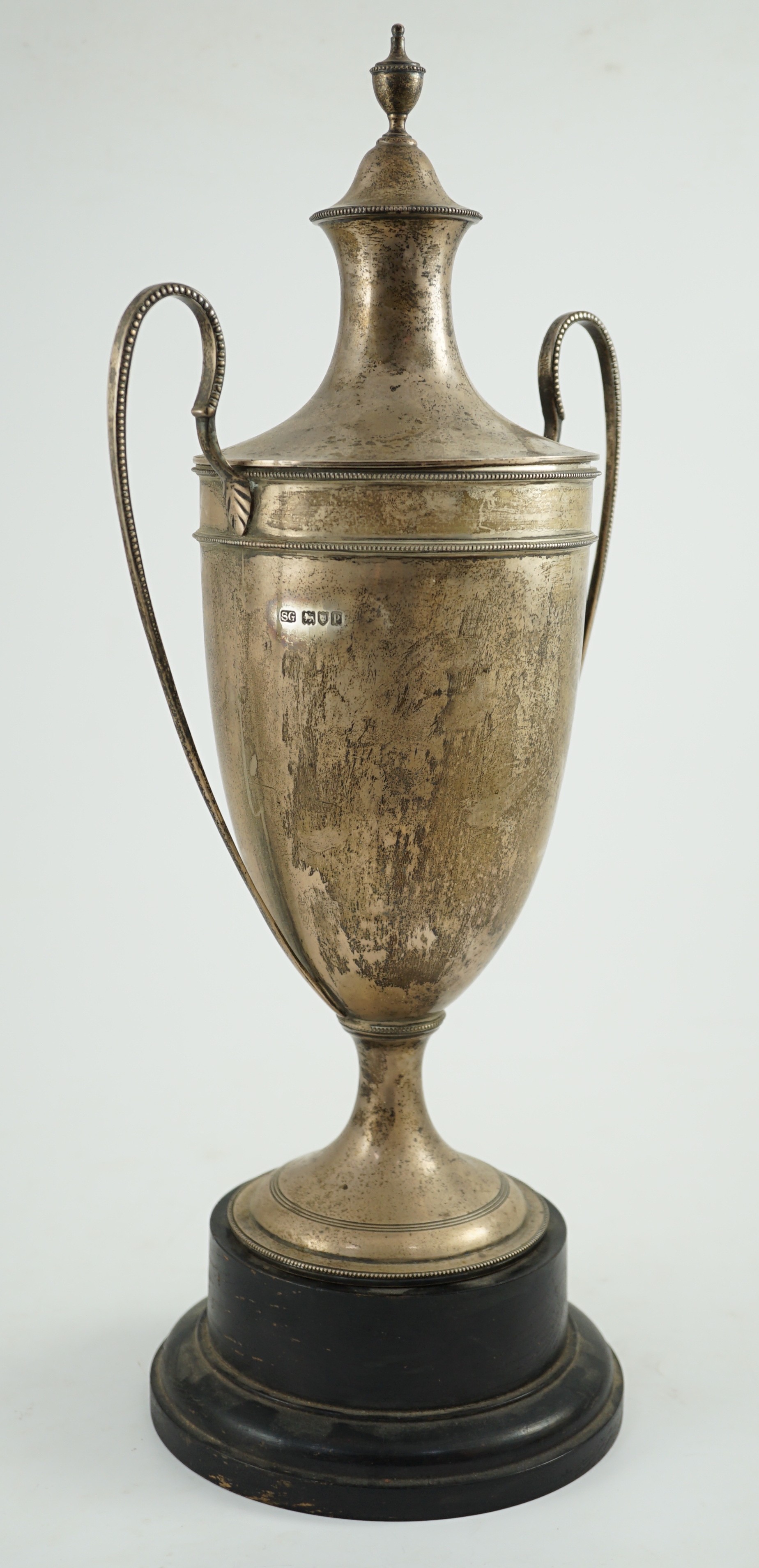 A George V silver two handled cup and cover by Sebastian Garrard